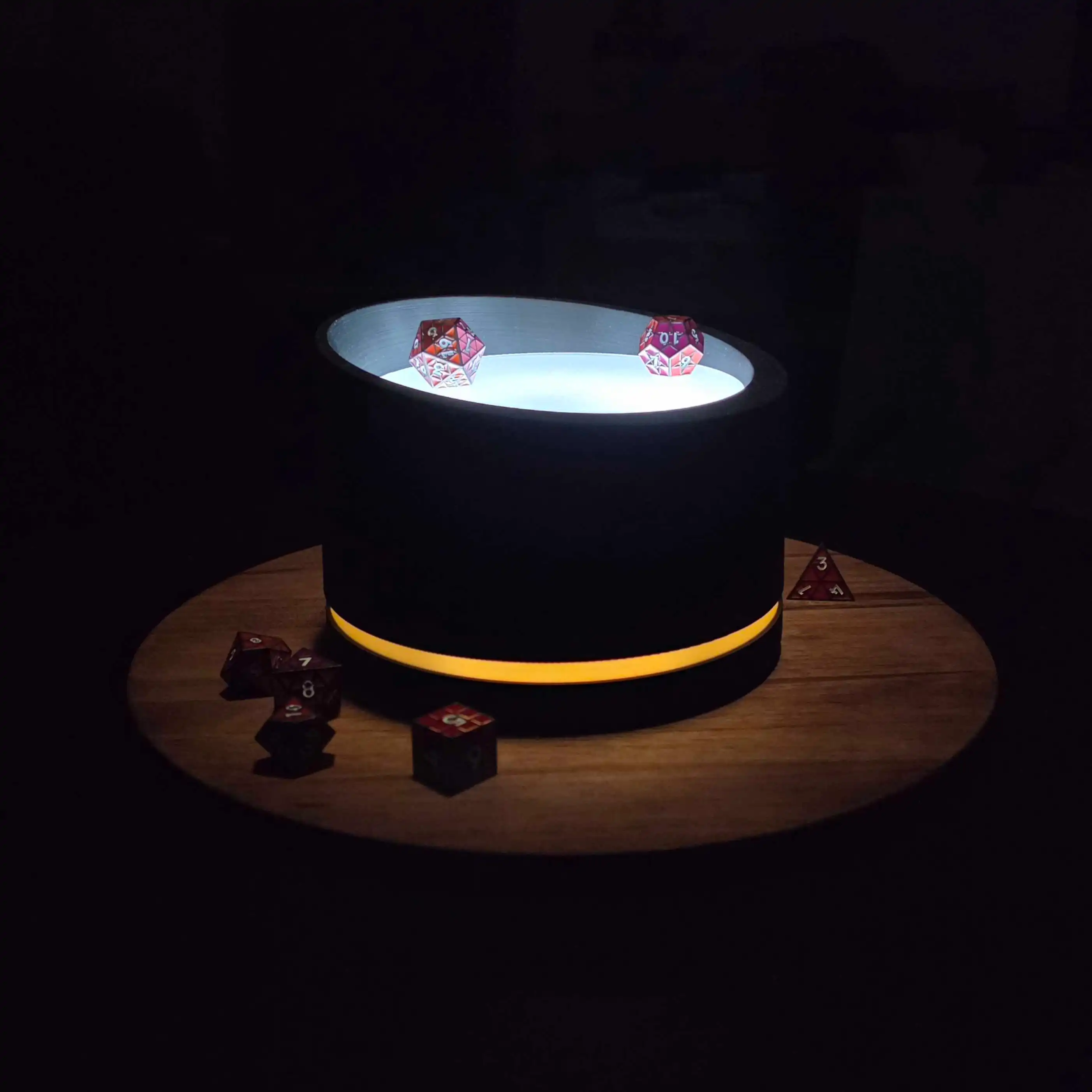 Dice resting in The Oracle's lit tray